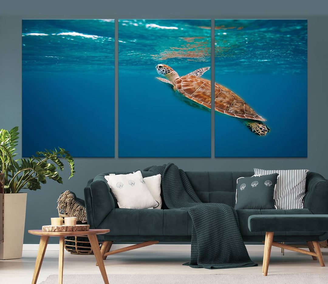 The living room features the "Baby Turtle in Ocean" wall art canvas print. This gallery-quality piece, depicting a sea turtle swimming underwater, adds an elegant touch to the space.