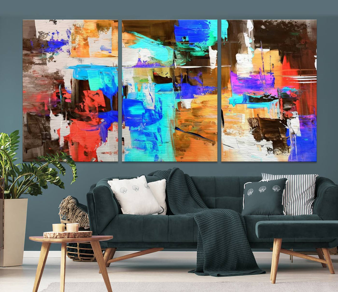 In a modern living room, the "Colorful Abstract Wall Art Canvas Print" serves as a stunning triptych centerpiece on museum-quality canvas, ready to hang. Its UV-protective coating ensures enduring vibrancy.