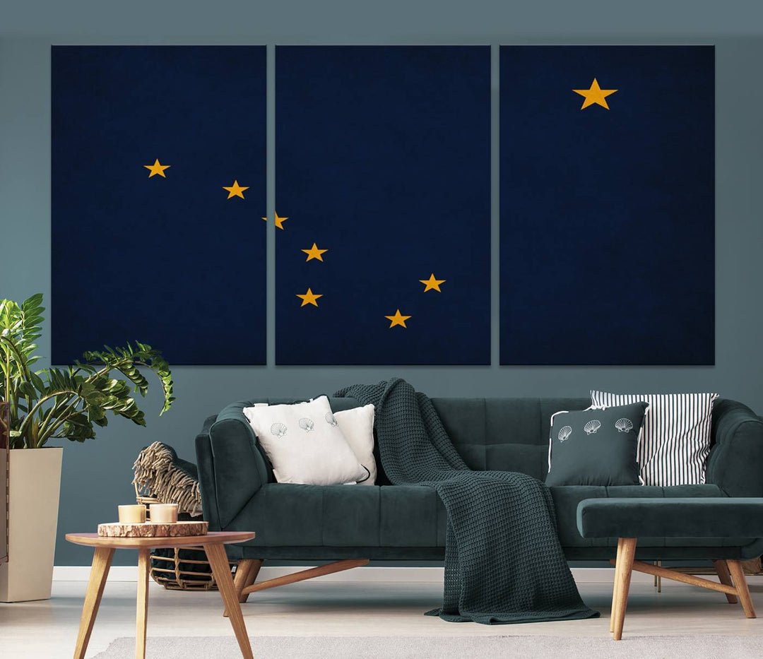 A contemporary living room featuring a triptych artwork of stars on a navy background, accentuated by the striking Alaska States Flag Wall Art Canvas Print.