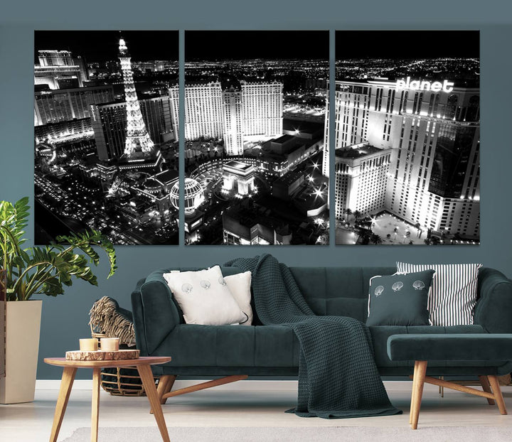 The Las Vegas Wall Art Canvas Print is a black and white triptych that showcases a city skyline at night. Crafted on museum-quality canvas with a UV-protective coating, it serves as an elegant and ready-to-hang focal point in the room.