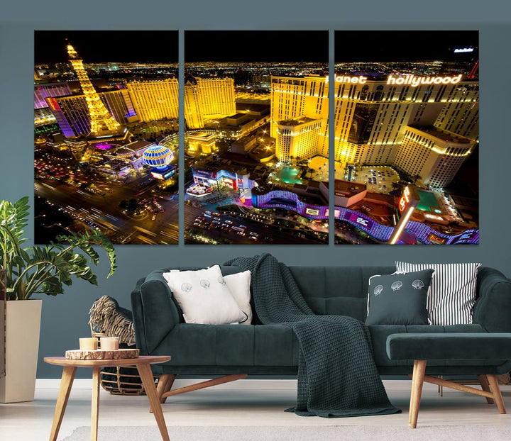 The modern living room features a Las Vegas Wall Art Canvas Print, a museum-quality triptych showcasing a vibrant cityscape with neon lights.