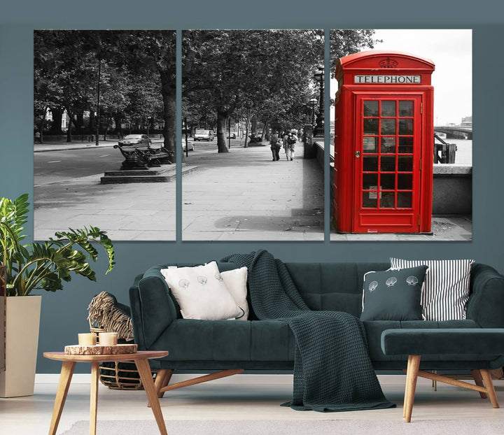 The London Phone Club Wall Art is a stunning piece that showcases a red telephone box set in a black and white street scene on museum-quality canvas. It is gallery wrapped with a UV-protective coating to preserve its vibrant charm.