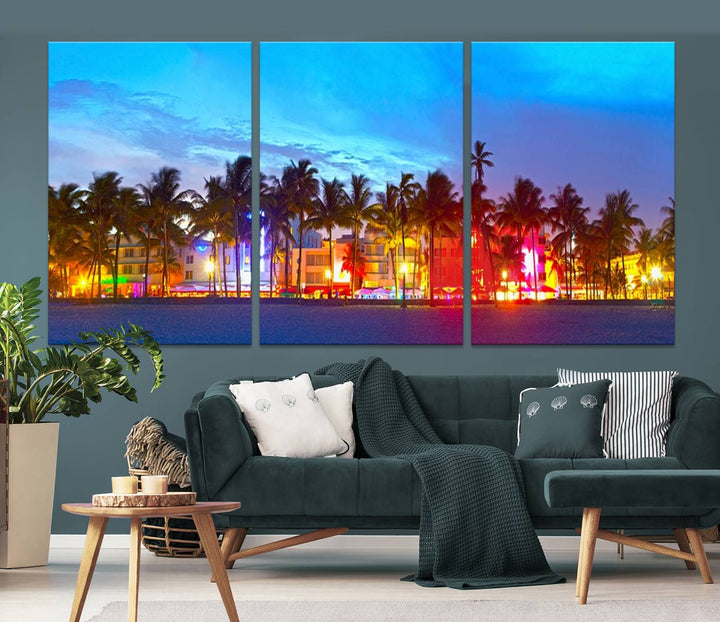 The living room features a three-panel Miami City Wall Art Canvas Print, showcasing a colorful, illuminated beach scene with palm trees on museum-quality canvas.