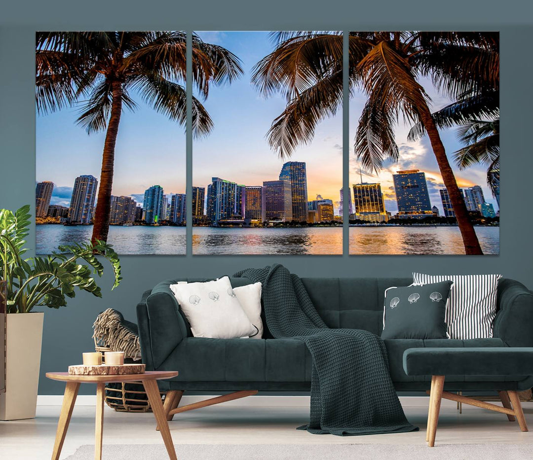 The Wall Art MIAMI Canvas Print features a triptych design depicting palm trees and a city skyline at sunset.