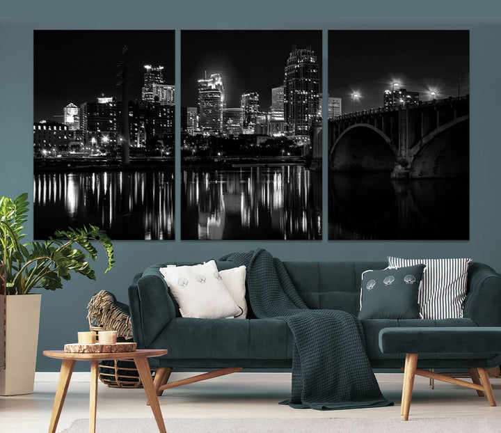 The "Minneapolis Wall Art Canvas Print, Minnesota City Wall Art Print, Minnesota Cityscapes Wall Art" features a black and white triptych of a city skyline with a bridge. Crafted on museum-quality canvas, this gallery-wrapped artwork is finished with a UV-protective coating to ensure lasting beauty.