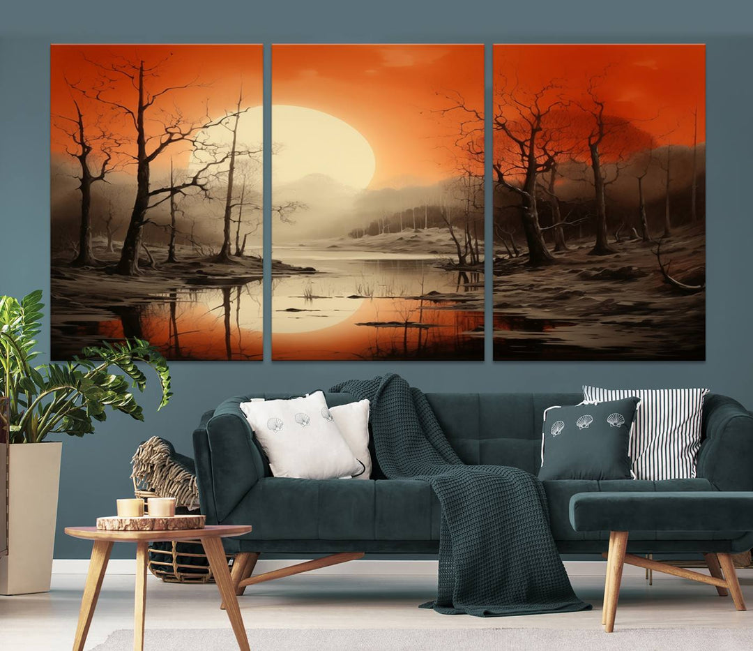 The "Abstract Watercolor Trees and Sunset on Lake Wall Art" is a triptych masterpiece, showcasing an orange-hued landscape of barren trees and a large sun. Displayed on museum-quality canvases with UV-protective coating, it creates a striking visual element in any space.