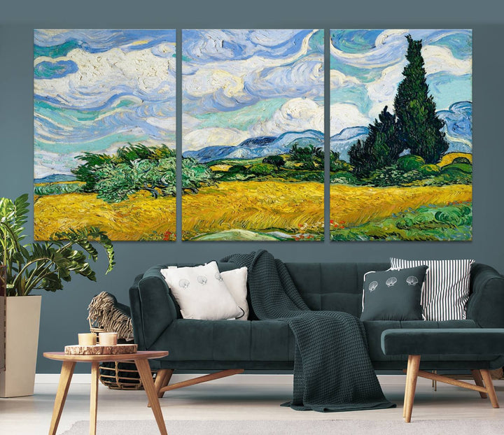 A contemporary living room features a large triptych of "Wheatfield With Cypresses By Van Gogh Painting Wall Art Canvas Print." Crafted on museum-quality canvas, this artwork brings a sense of elegance and craftsmanship reminiscent of professional artistry.