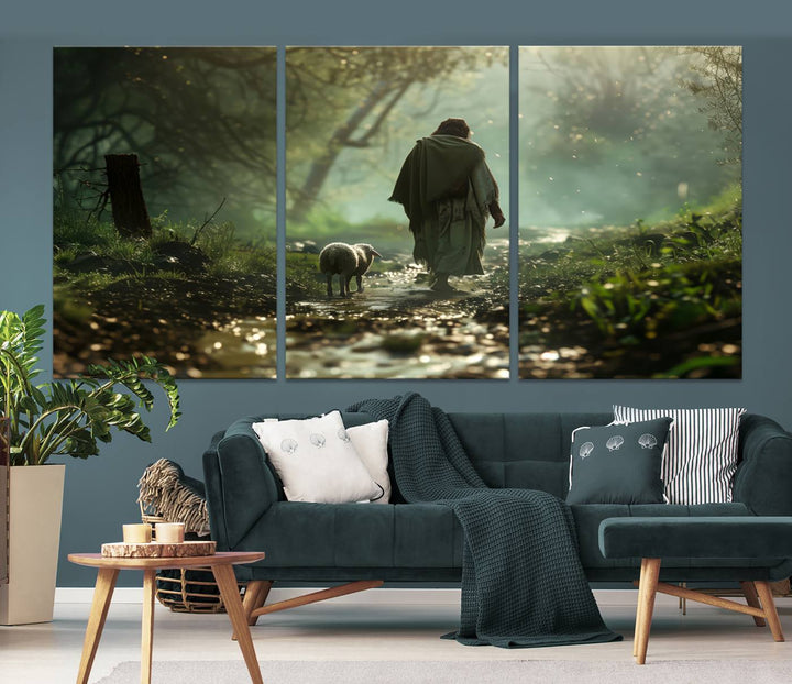 The wall art piece, titled "Jesus Shepherd a Lost Lamb Canvas Wall Art Print," is suspended on the wall and depicts a robed figure and a lamb wandering along a forest path.