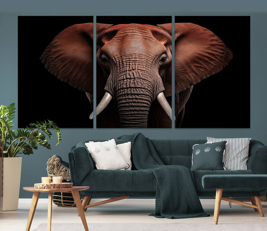 A stunning triptych titled "Wild Elephant Wall Art Canvas Print" beautifully enhances the wall above a contemporary living room. This Africa Savannah Wild Animal Wall Decor Print is of museum-quality, complete with a UV-protective coating to ensure its vibrancy and beauty are preserved for years.