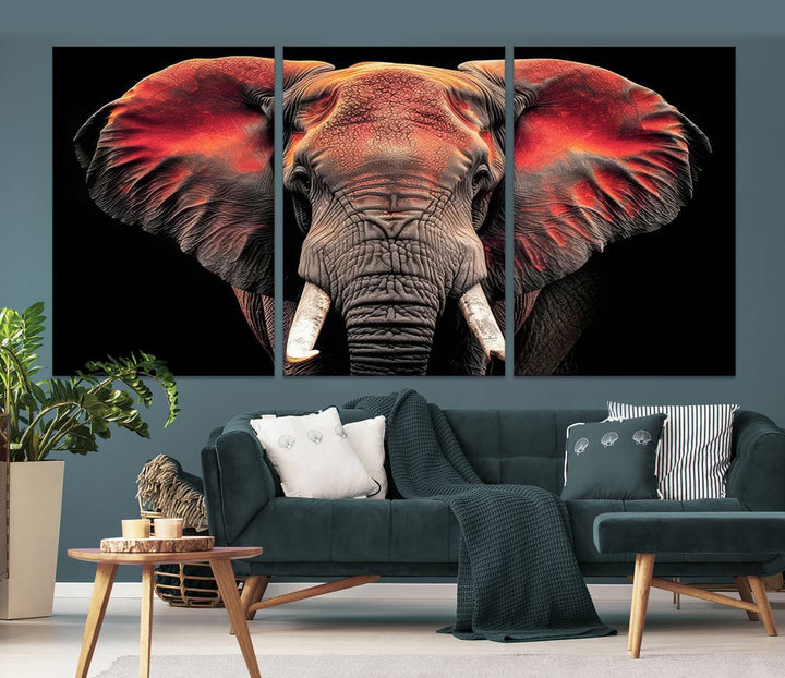 The Elephant Wall Art Canvas Print, featuring vibrant red and black tones, is a stunning artwork printed on museum-quality canvas. It comes with a UV-protective coating.