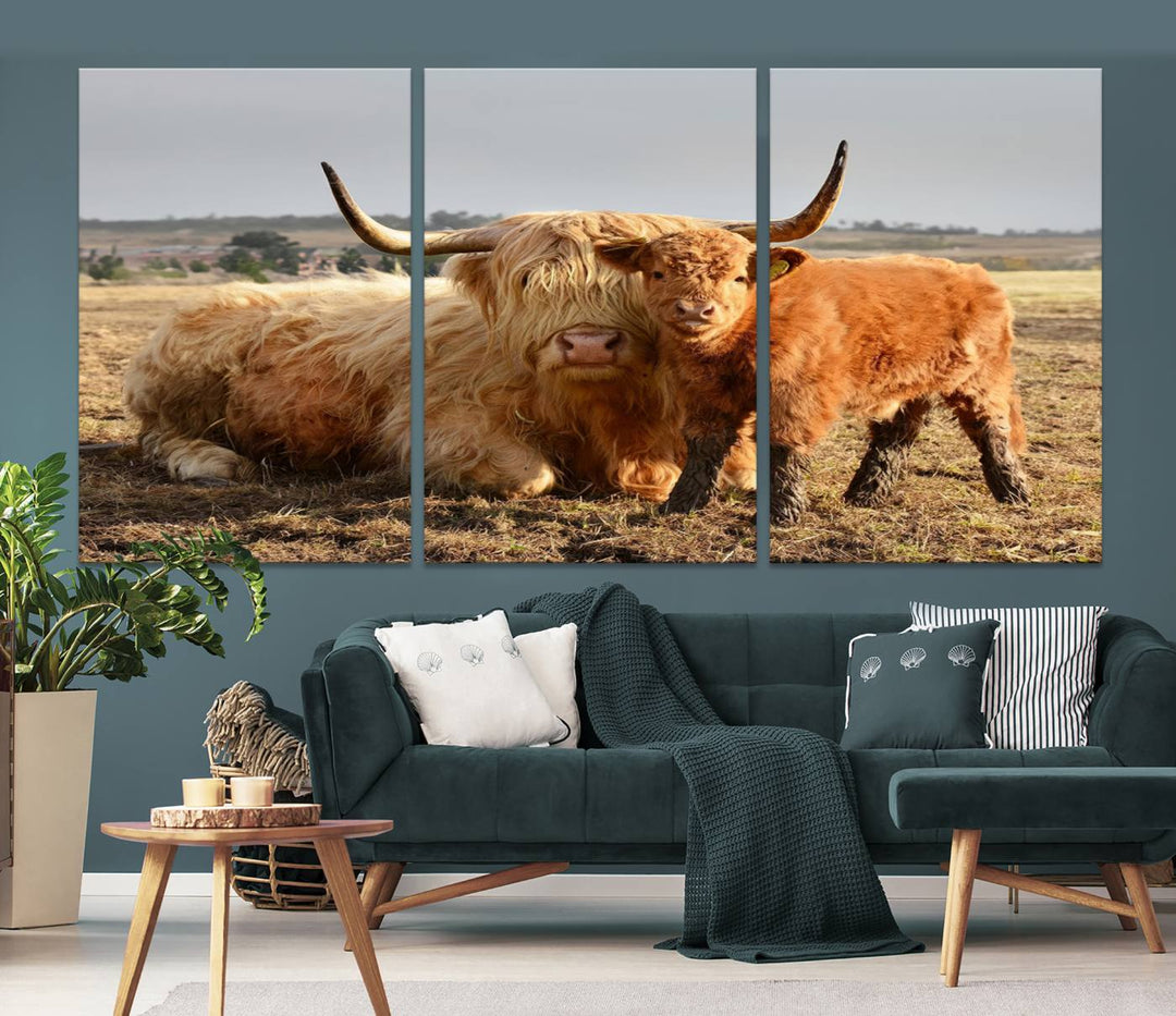 The three-panel canvas artwork, titled "Highland Cow Canvas Wall Art Animal Print for Farm House Decor," features a serene scene of a resting Highland cow and calf in a field. The piece highlights its gallery-quality finish.