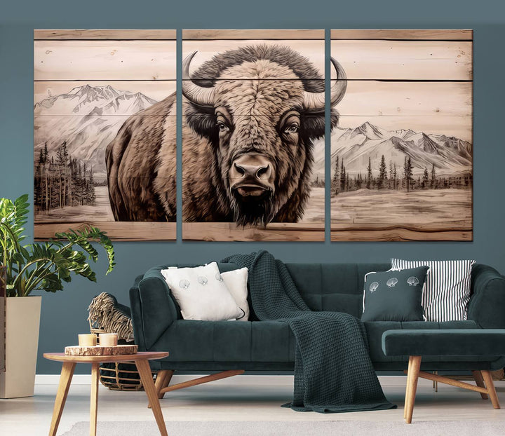 A stunning triptych artwork from the "Bison Canvas Wall Art American Buffalo Print Rustic Decor for Farmhouse Wall Art" collection graces the modern living room. Its vibrant colors are enhanced by museum-quality canvas and a UV-protective coating. The gallery-wrapped piece adds elegance to the space.