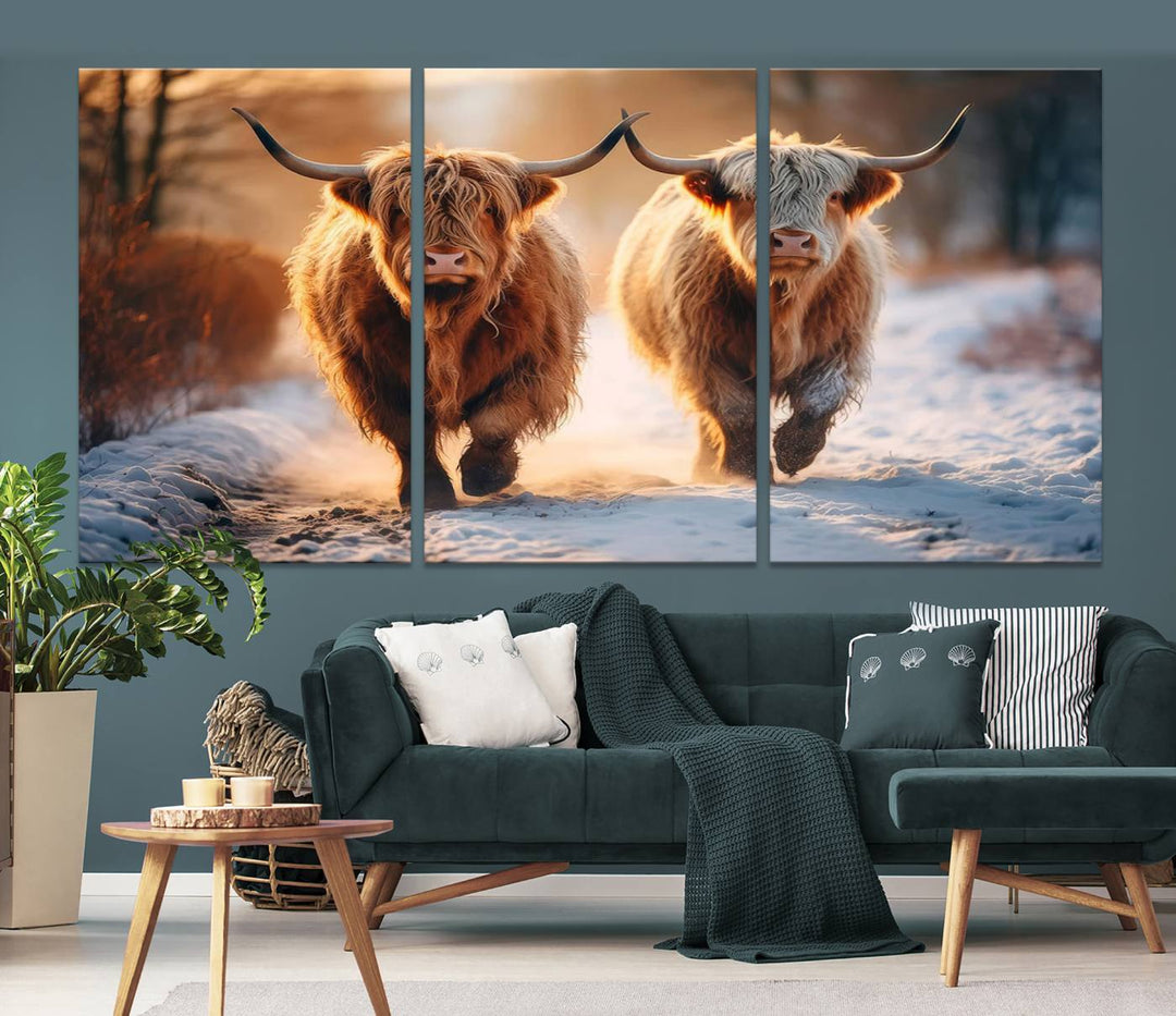 The living room showcases a triptych from the Scottish Highland Cow Horn Farm Wall Art Canvas Print collection, depicting two Highland cows running in the snow. Complementing this are handmade wall art pieces with a gallery-quality finish that add an elegant touch.