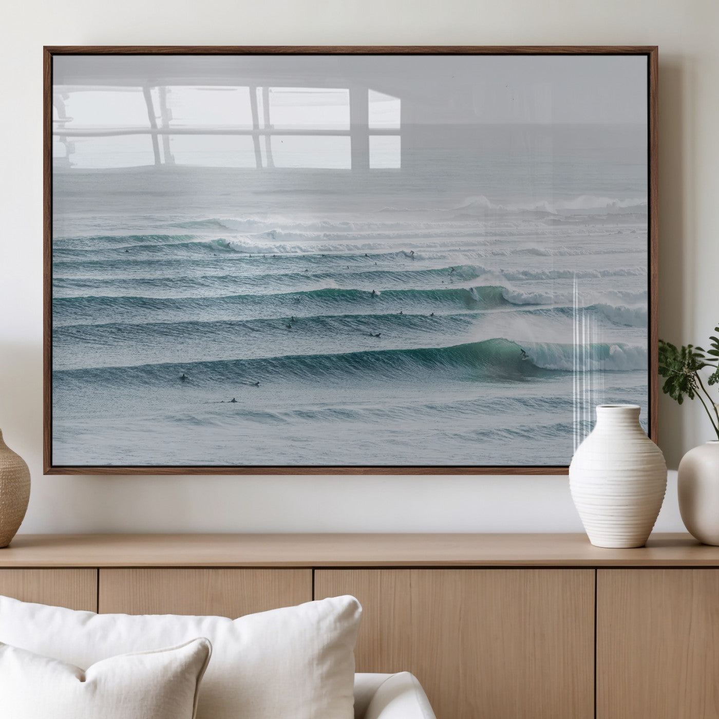 High-angle view of surfers lining up across layered ocean waves, ideal for minimal coastal or surf-inspired room decor.
