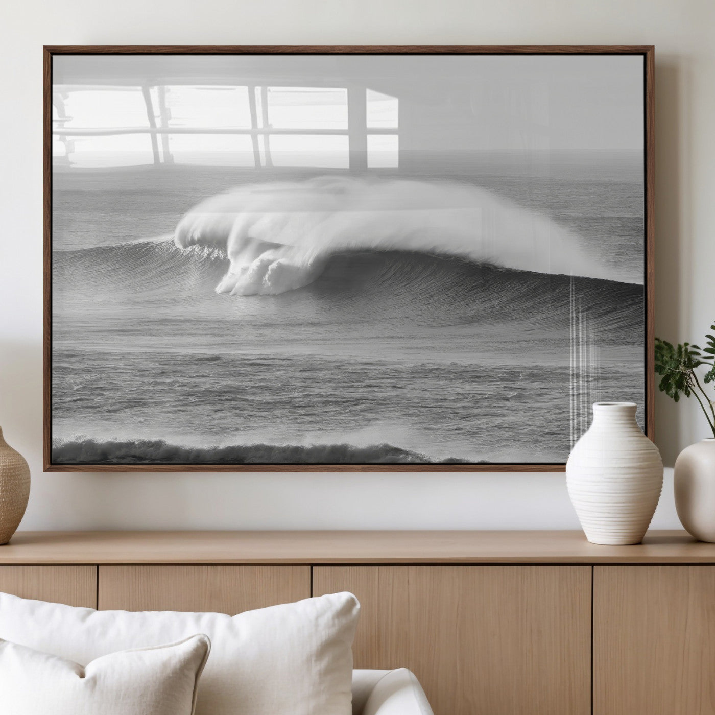 A dramatic black and white ocean wave crashing with immense force, capturing the raw power and movement of the sea in a bold seascape.