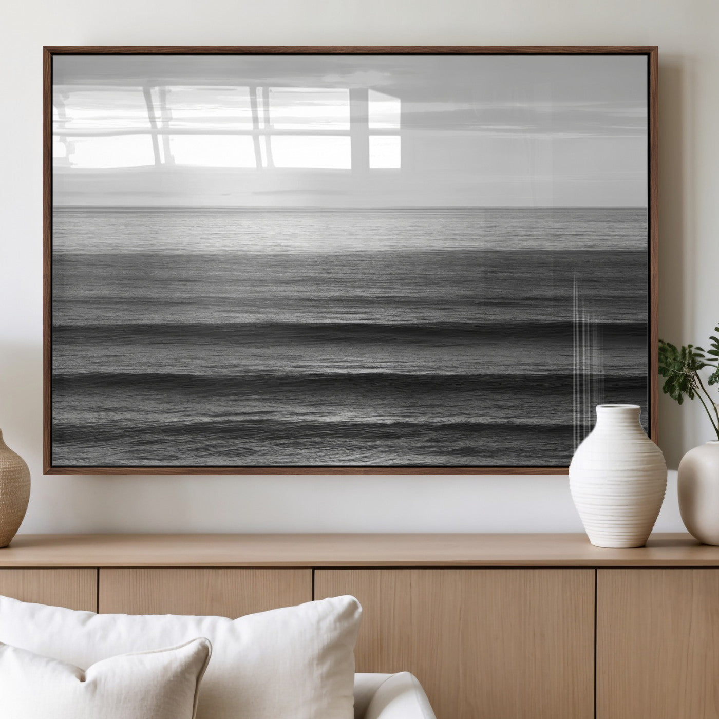 Minimalist black and white ocean view with layered waves reflecting sunlight, evoking a sense of calm and coastal serenity.