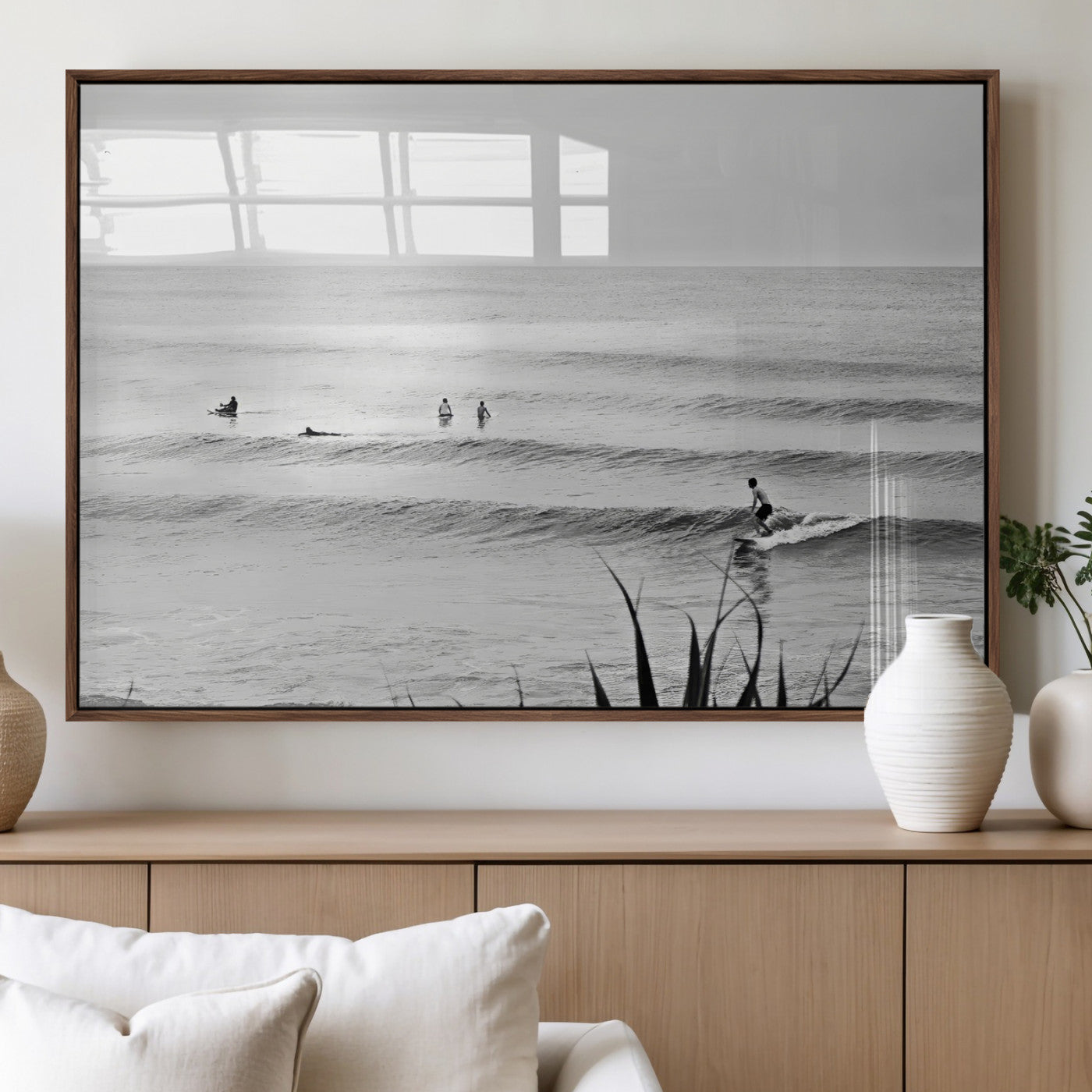 Monochrome canvas of surfers on calm ocean waves, ideal for minimalist coastal or beach-inspired interior decor.