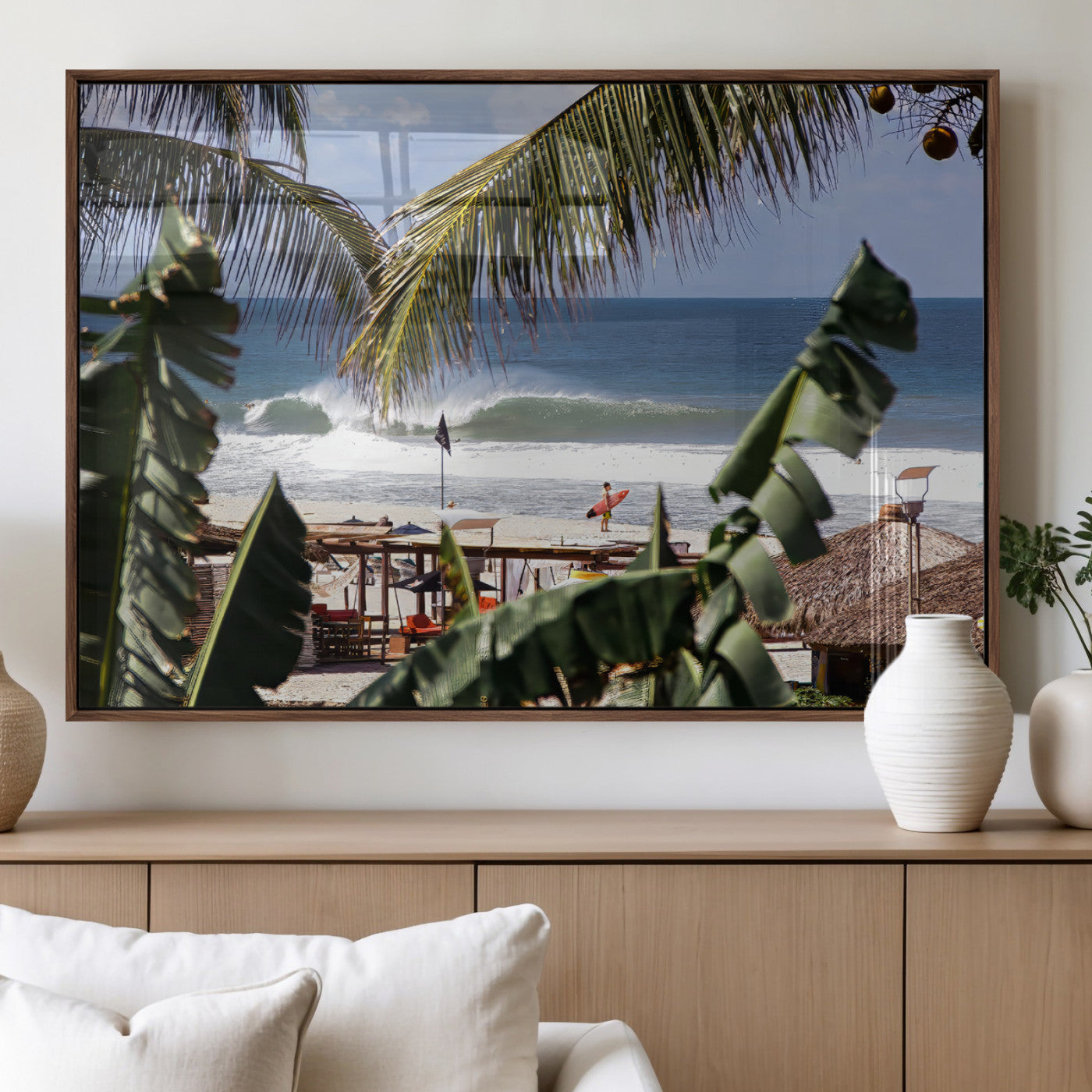 Canvas wall art of a tropical surf scene framed by palm trees, with a surfer on the shore and waves rolling in, ideal for beach-themed decor.