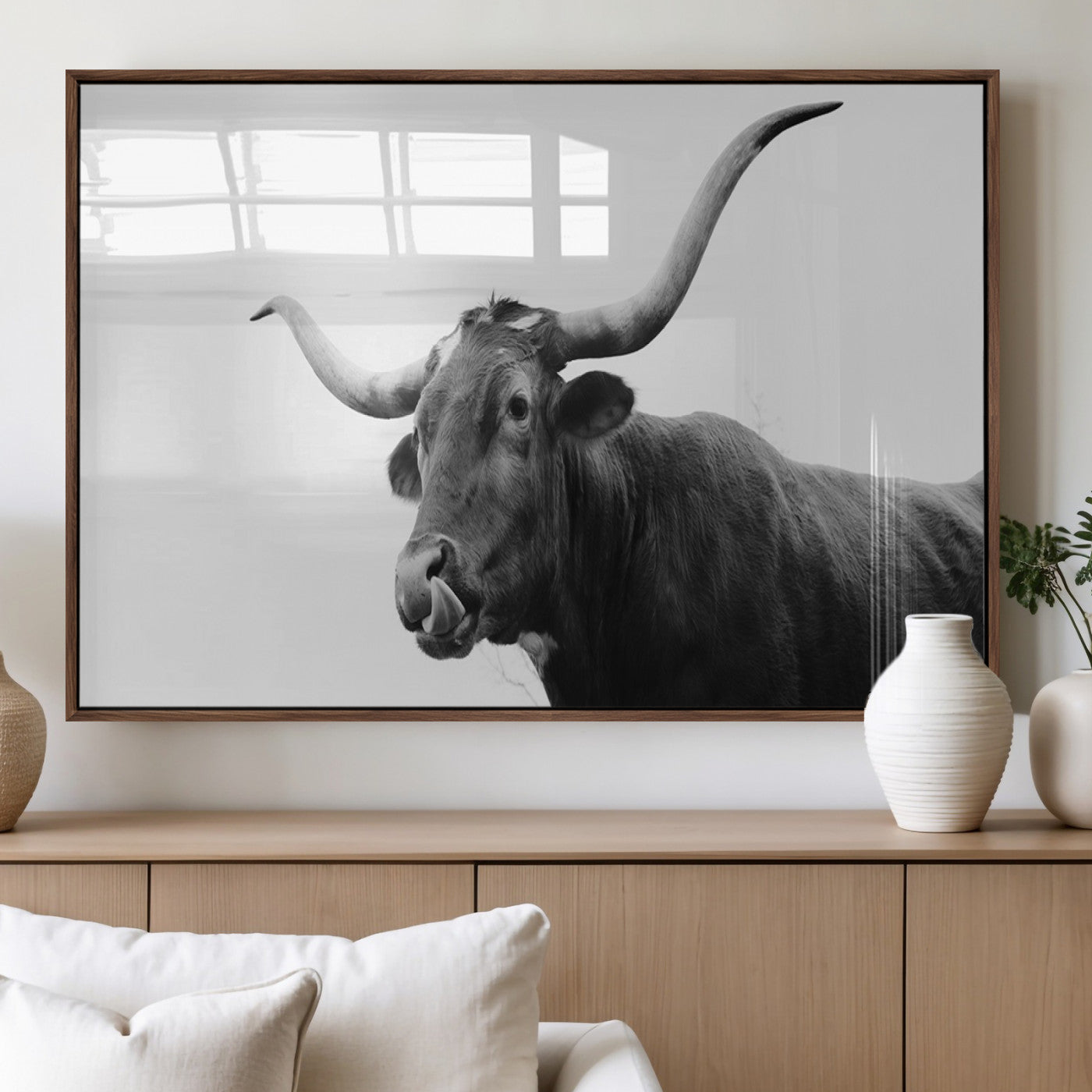 Black and white photo of a Texas Longhorn cow with curved horns, ideal for rustic, western or minimalist style home decor.