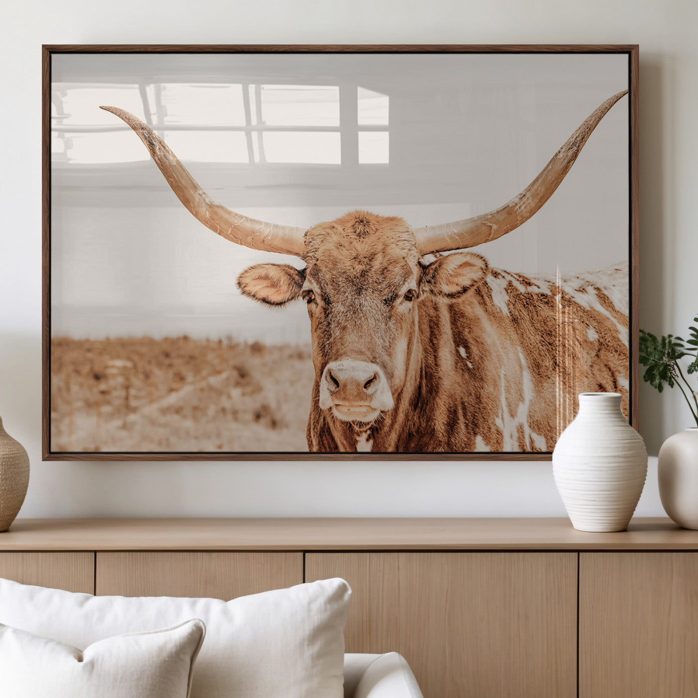 Sepia-toned Texas Longhorn facing forward in a dry field, perfect for rustic farmhouse or western-themed neutral home decor.