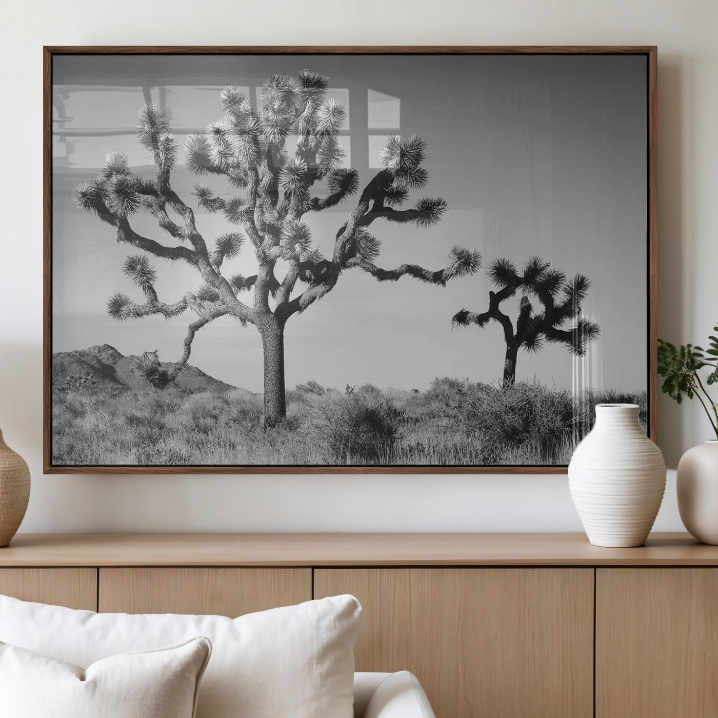 Black and white desert scene with two Joshua trees under clear sky, perfect for rustic or boho-inspired home decor.