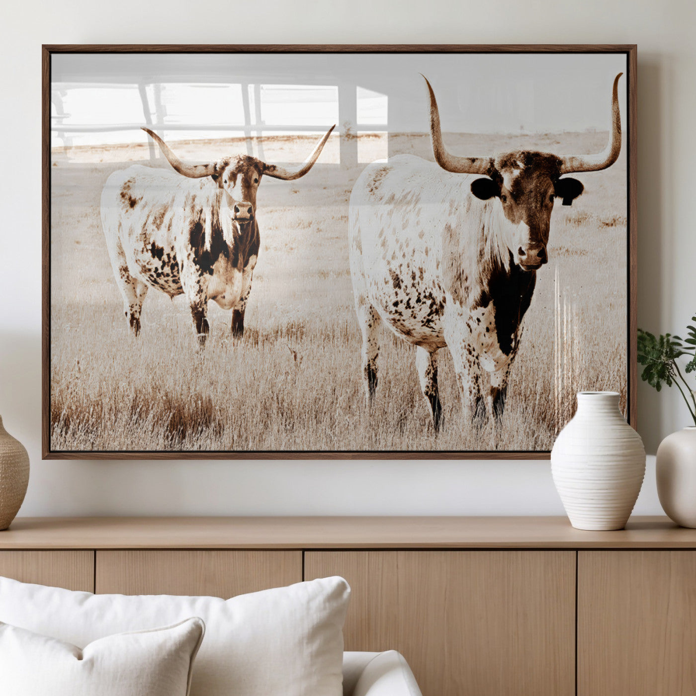 Two Texas longhorn cows standing in a sepia-toned pasture, evoking rustic charm perfect for farmhouse or western country interiors. (