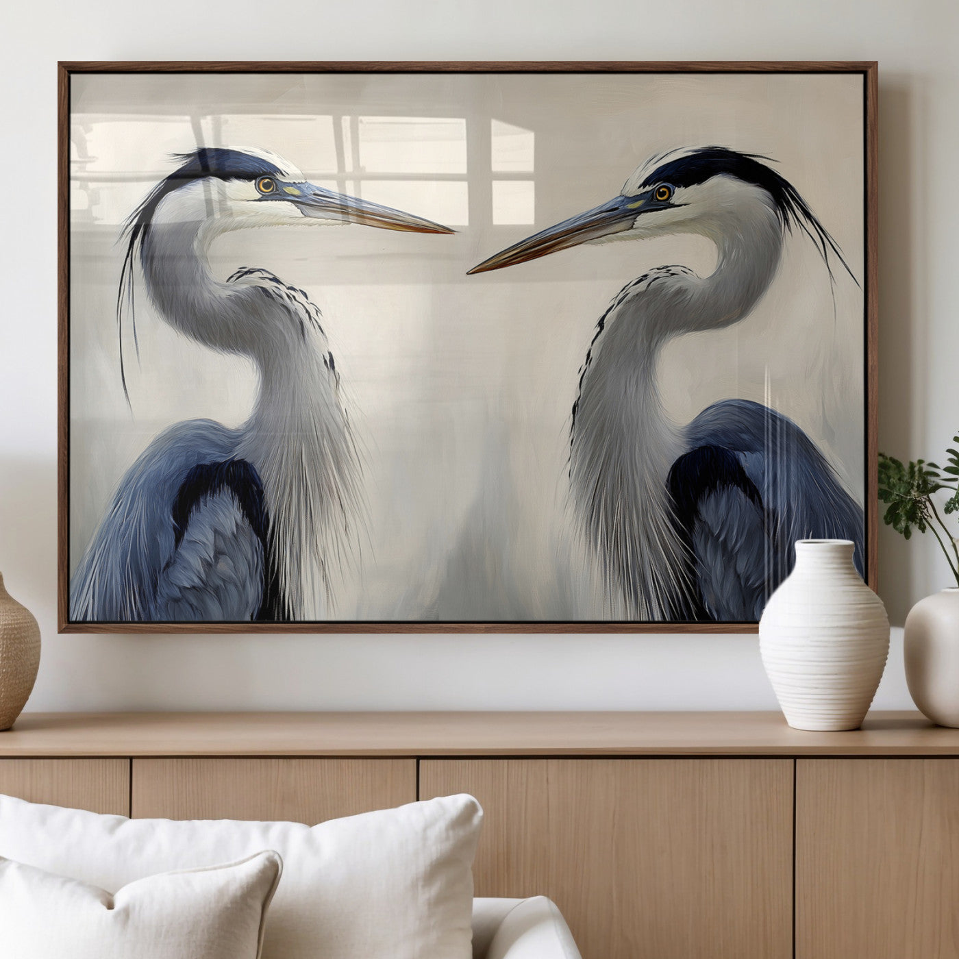Two blue herons facing each other on a soft neutral background, ideal for coastal, tranquil, or nature-inspired minimalist interiors.