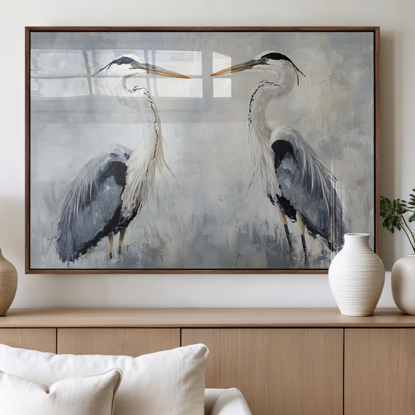 Two herons facing each other on a soft-toned background with blue-grey feathers, perfect for tranquil, coastal or nature-themed interiors.