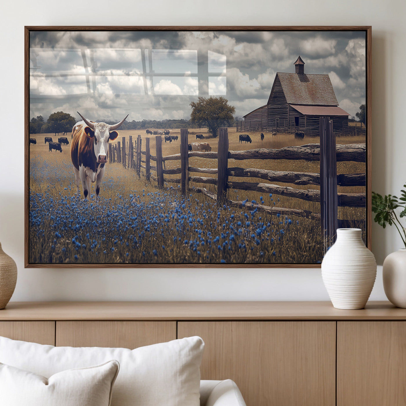 Framed canvas print of a Texas Longhorn near a rustic barn and fence, ideal for farmhouse or western-style home wall decor.