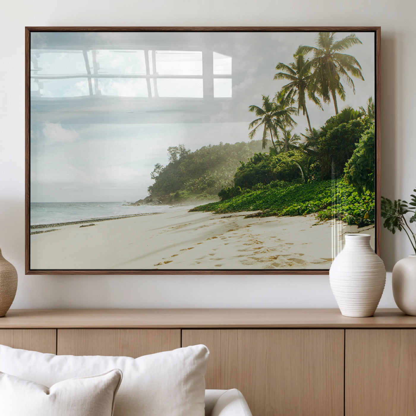 A tropical beach with palm trees, soft sand, and ocean waves under a bright sky, creating a peaceful and relaxing coastal view.
