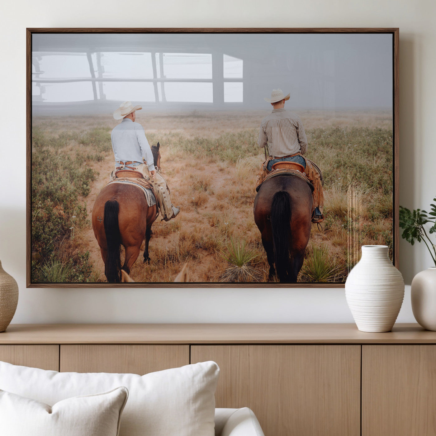 Two cowboys riding horseback through a misty prairie, capturing the rustic and adventurous spirit of the Western frontier.