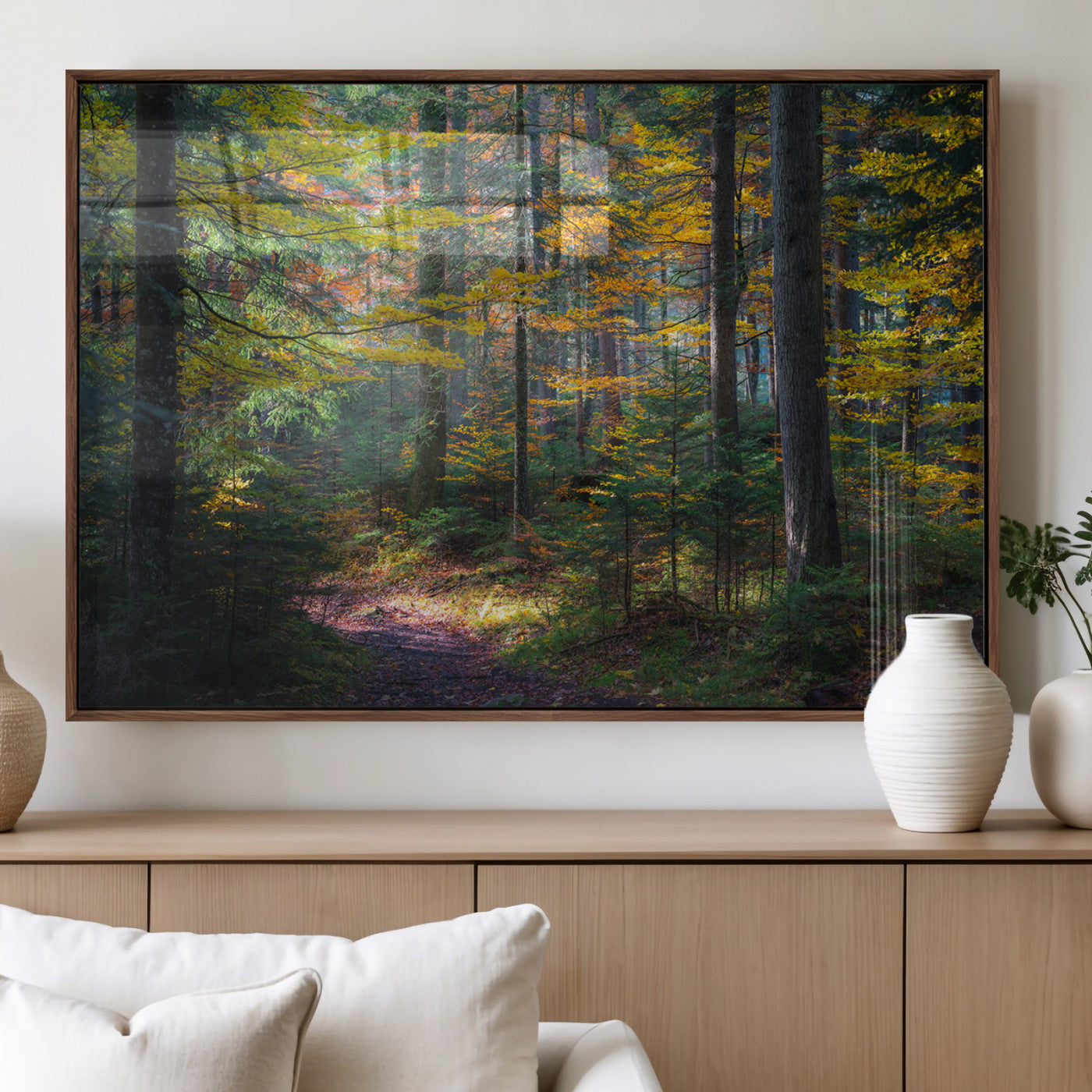 A serene autumn forest with golden and green leaves, a misty atmosphere, and a sunlit pathway, creating a tranquil nature-inspired wall art piece.