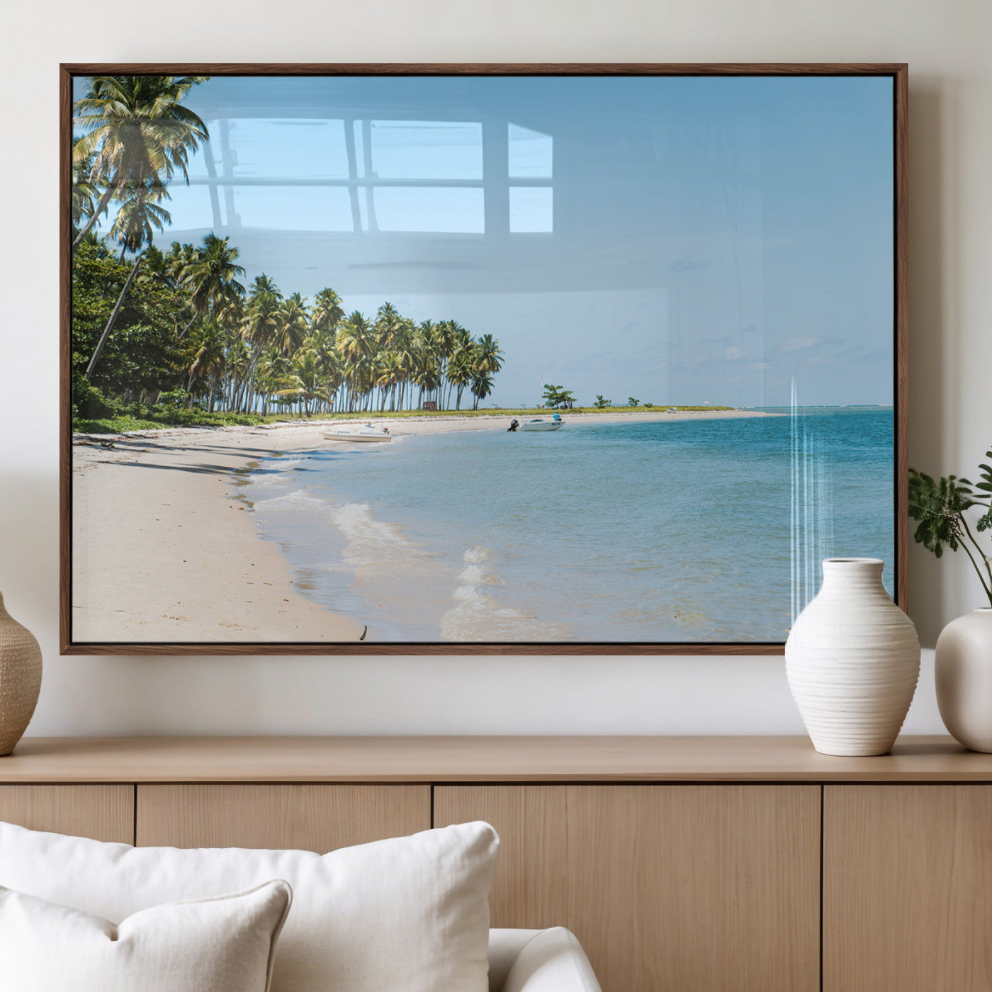 A serene tropical beach with clear blue water, soft sand, and lush palm trees under a bright sky, creating a peaceful island paradise atmosphere.