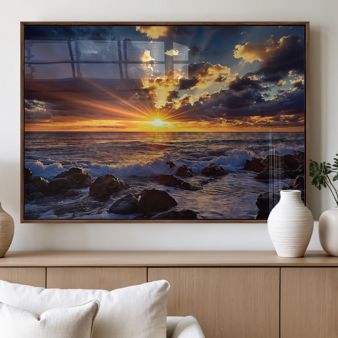 An explosive sunset over the ocean with dramatic clouds and rays of sunlight reflecting off the water, creating a vibrant and captivating view.
