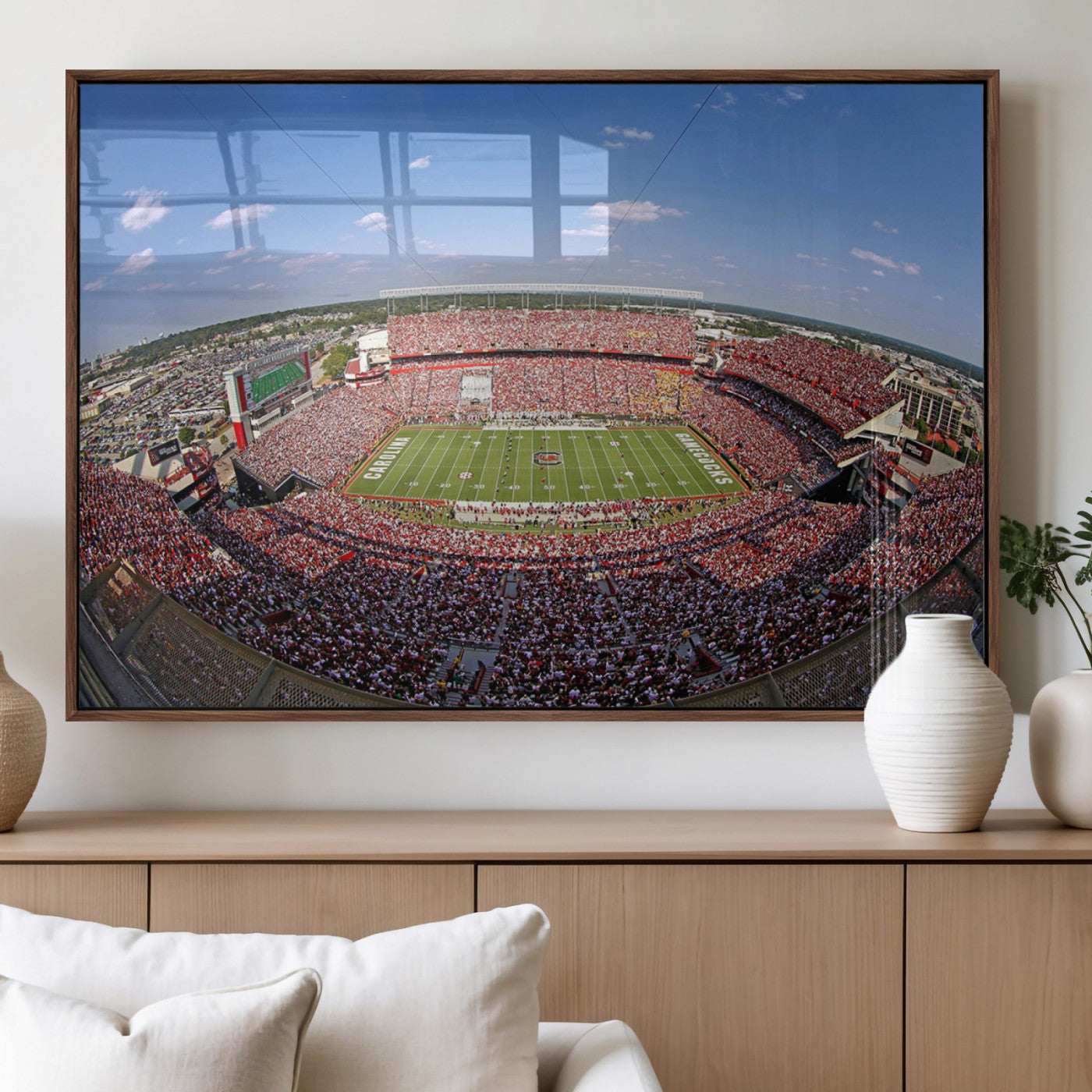 An William Brice-Stadium view of a full football stadium with cheering fans and clear blue skies, capturing the excitement and energy of the game.