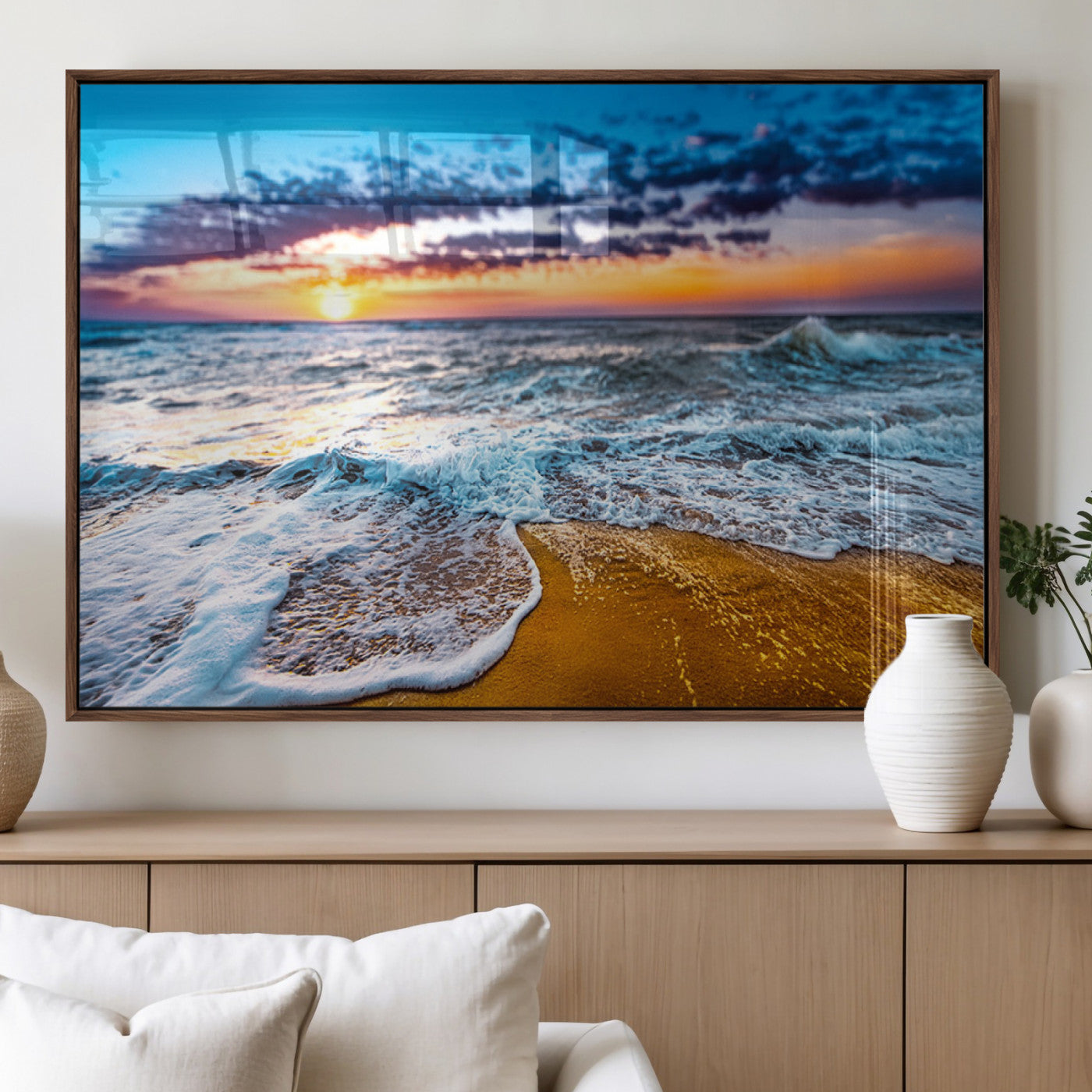 Beautiful ocean shoreline at sunset with foamy waves washing onto golden sand under a colorful sky – Wall Art Canvas Print.