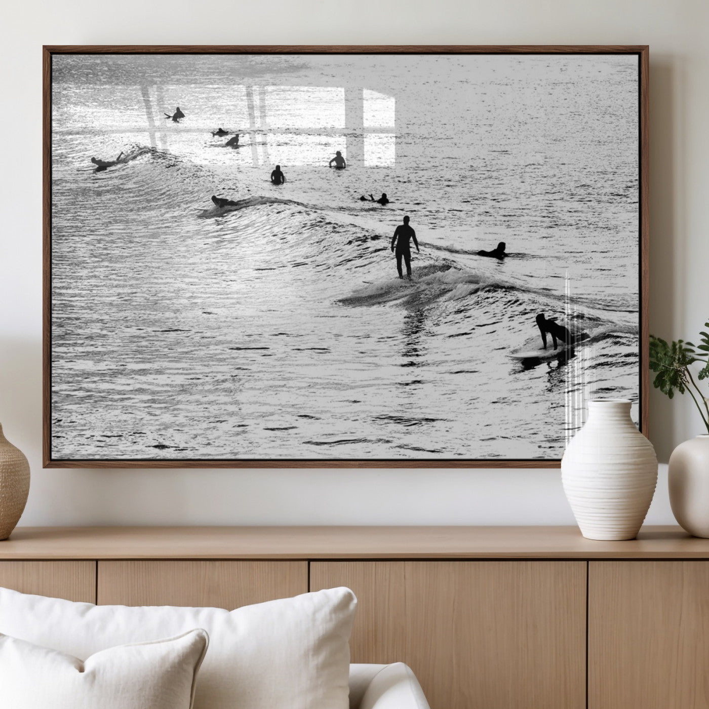 19970637-MGV-CV-60X30-3P_Walnut-Black and white artistic view of surfers riding and paddling on waves in the ocean, capturing the dynamic motion and energy of surfing