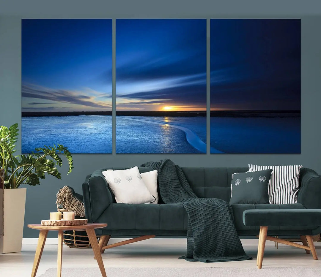 The living room features a triptych of the Wall Art Canvas Print Navy Sunset Lake Landscape Artwork, adding to its tranquil vibe.