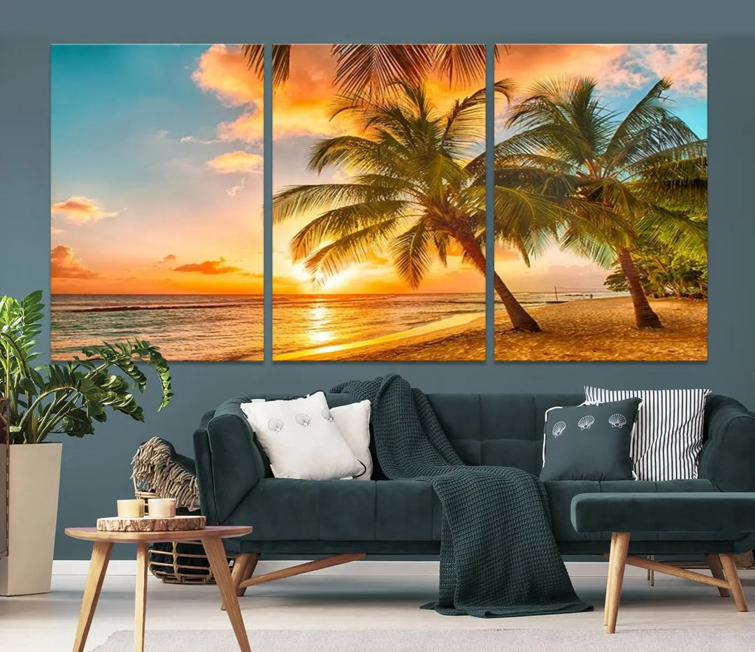 The Tropical Sunset Wall Art Print features a vibrant beach scene with palm trees and an ocean view highlighted by a golden sunset.