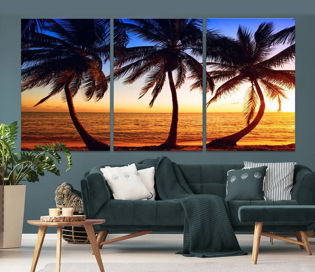 The living room features a wall adorned with the "Wall Art Canvas Curve Palms at Sunset on Beach," showcasing gallery-wrapped, museum-quality canvases in a stunning triptych.