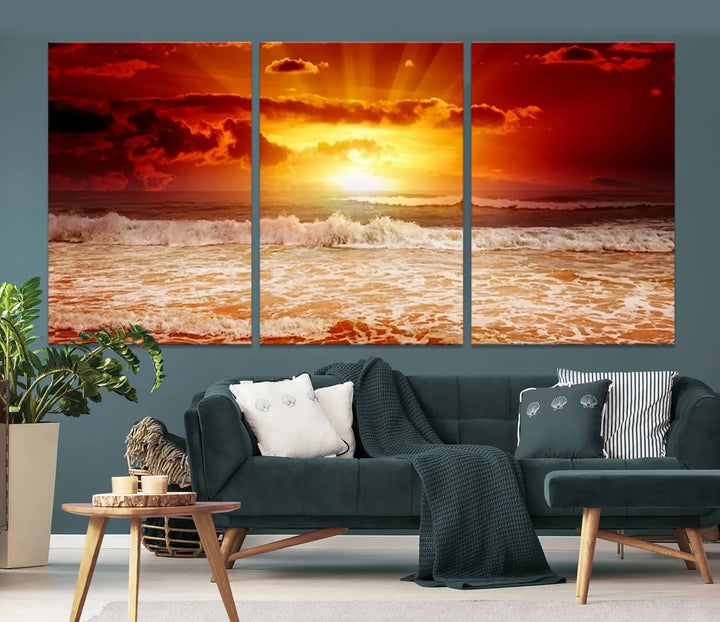 In a modern living room, the vibrant "Wall Art Canvas Perfect Sunset Turns Colour of Sea and Sky to Red," printed on museum-quality canvas, stands out. A floor lamp casts warm light over the ready-to-hang artwork, which includes a UV-protective coating to ensure lasting brilliance.