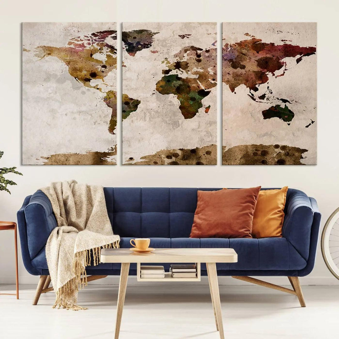 A Watercolor World Map Canvas Print, wrapped in an elegant gallery style, hangs on the wall.