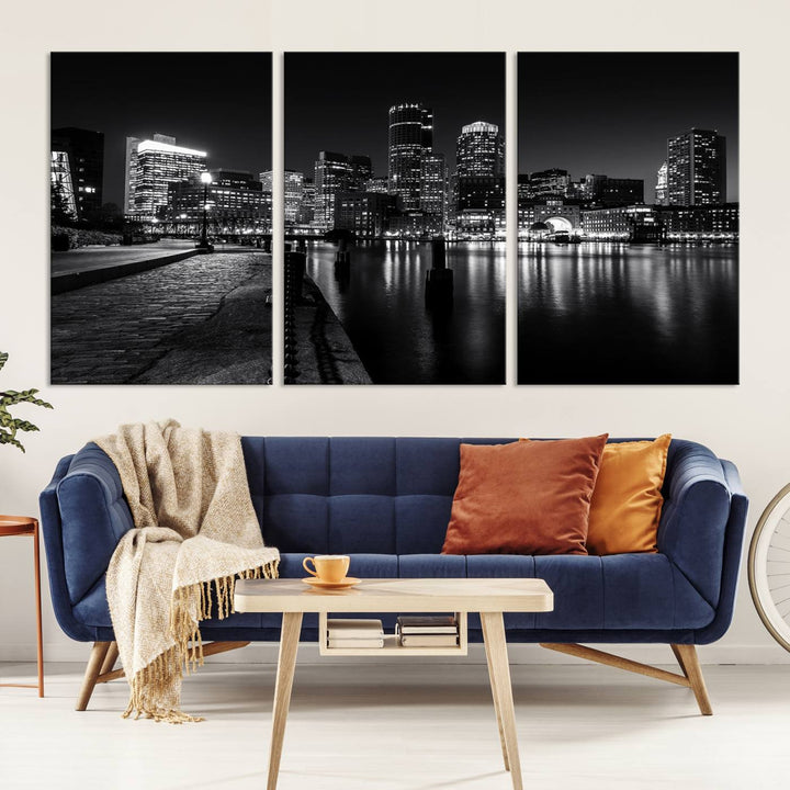 The Boston Lights Skyline Black and White Wall Art Cityscape Canvas Print, crafted with museum-quality canvas and UV-protective coating, serves as a striking triptych centerpiece in the living room.