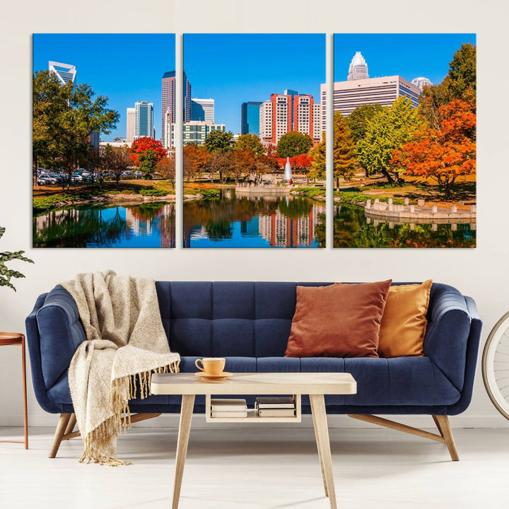 The Charlotte City Park at Fall Skyline Cityscape View wall art canvas print features a city panorama with a park and lake accented by autumn trees. It is mounted on museum-quality canvas with UV-protective coating and decorates the space.