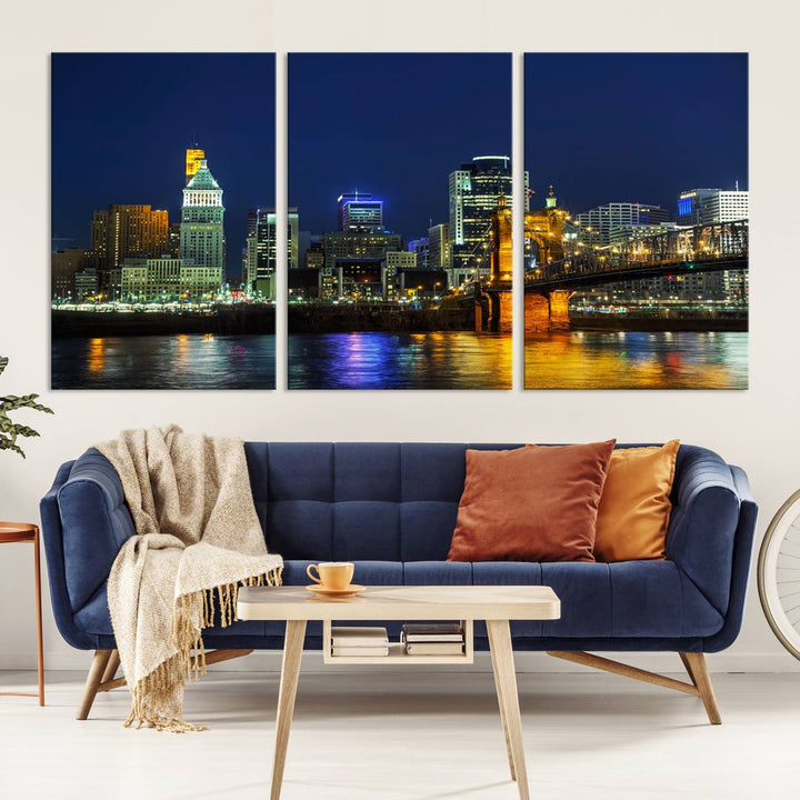 The "Cincinnati City Lights Night Skyline Cityscape" canvas print, displayed above a sofa, exhibits museum-quality craftsmanship with a UV-protective coating.