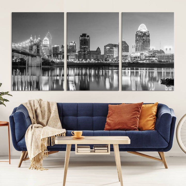 The "Cincinnati City Lights Skyline Black and White Wall Art Cityscape Canvas Print" is elegantly displayed in a stylish living room.