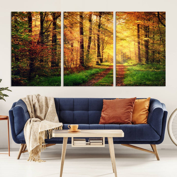 The Sunlight Through Trees Wall Art Canvas Print showcases a sunlit forest path in autumn on gallery-wrapped, museum-quality canvas with UV-protective coating.