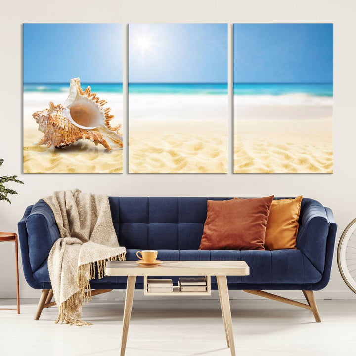 The Sea Shell on The Beach Sun Sand Wall Art Canvas Print is a triptych that beautifully captures a beach scene with a large seashell on the sand.