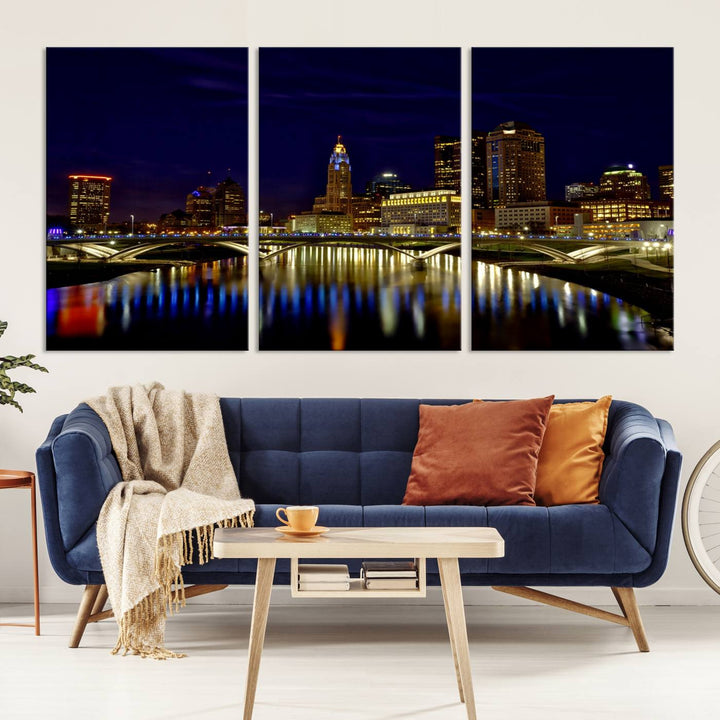 The "Columbus City Lights Night Skyline Cityscape View Wall Art Canvas Print" showcases a stunning city skyline at night, with illuminated buildings and bridges reflecting in the river, on a museum-quality canvas ready to hang.