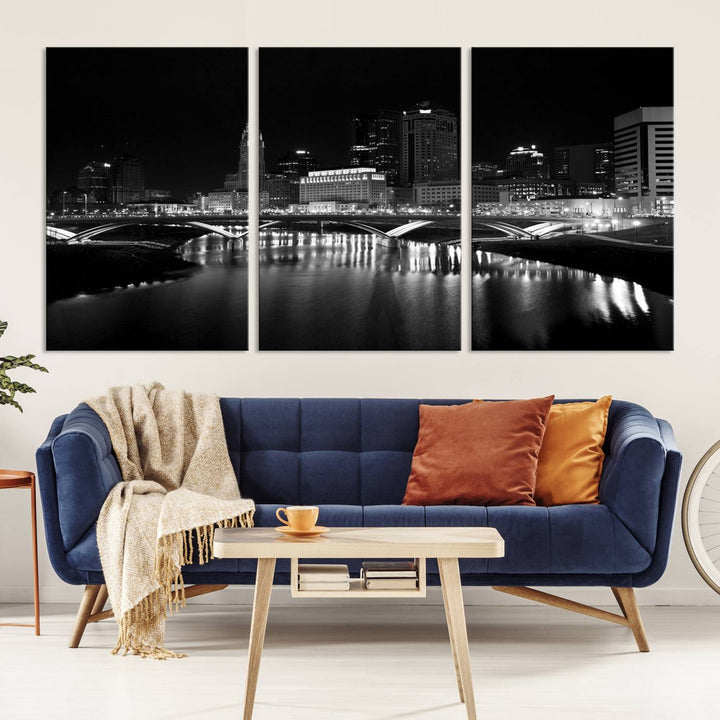 The living room features the "Columbus City Lights Skyline Black and White Wall Art Cityscape Canvas Print" above a coffee table. This artwork is presented as a triptych on museum-quality canvases with UV-protective coating.